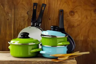 Pots and pans on a counter in a cabin