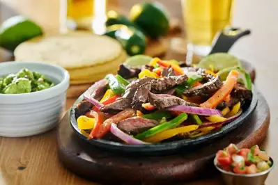 steak fajitas with onions and peppers