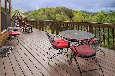 deck of a cabin on the river in pigeon forge