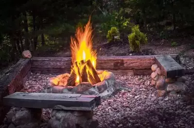 fire pit outside enchanted hideaway cabin in the smokies