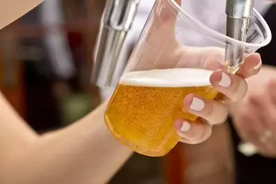 Beer being poured into a glass.