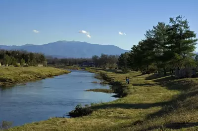 Little Pigeon River in Sevierville with a view of Mount LeConte