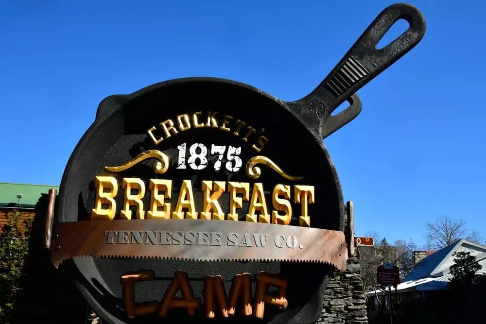 crockett's breakfast camp during winter standing in front of sign