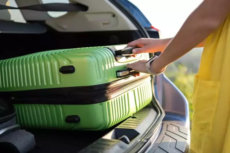 person packing the car for a vacation