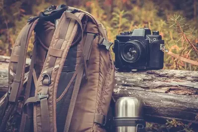 backpack, camera, and canteen