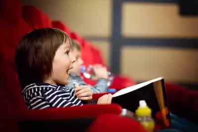 kid watching movie