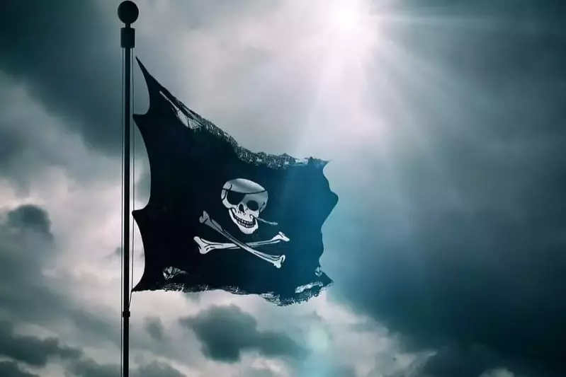 A pirate flag flying in the wind.