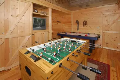 foosball and air hockey table in cabin