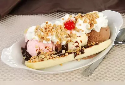 A classic banana split ice cream sundae.