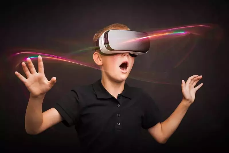 A mesmerized boy wearing a virtual reality headset.