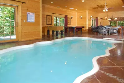 An indoor swimming pool in a luxury Gatlinburg cabin.