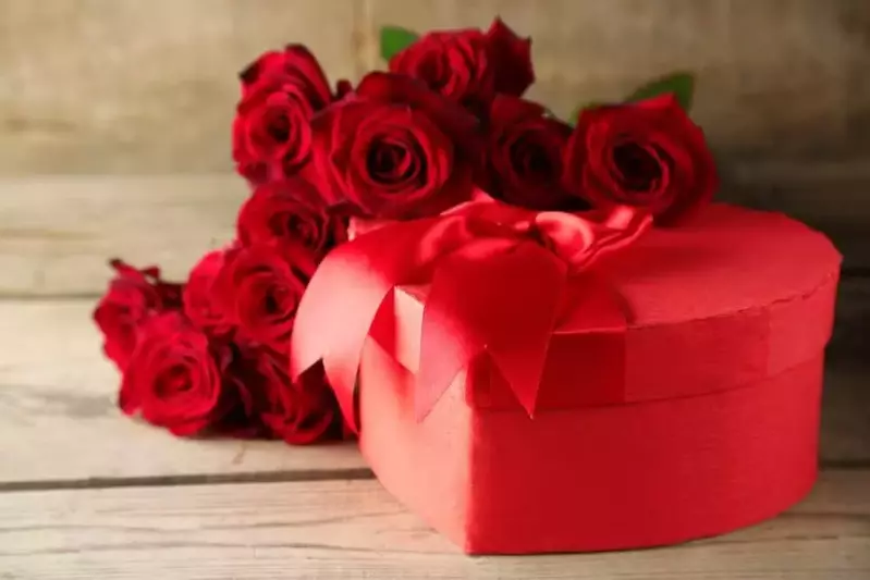 A Valentine's Day heart shaped gift box and red roses at one of our romantic Smoky Mountain cabins.