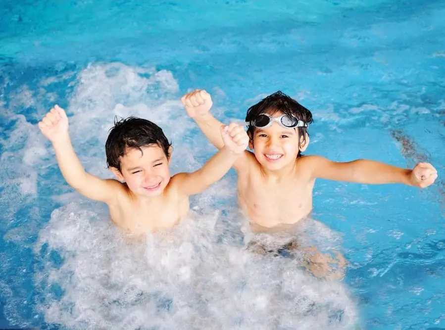 Two kids having fun at our Pigeon Forge cabins with indoor pools.