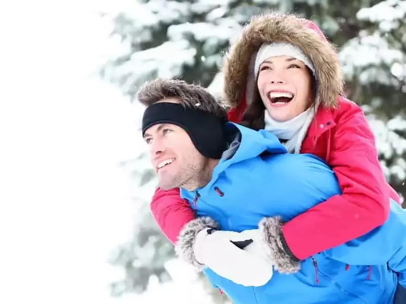 Happy couple hiking in the Smoky Mountains during the winter.