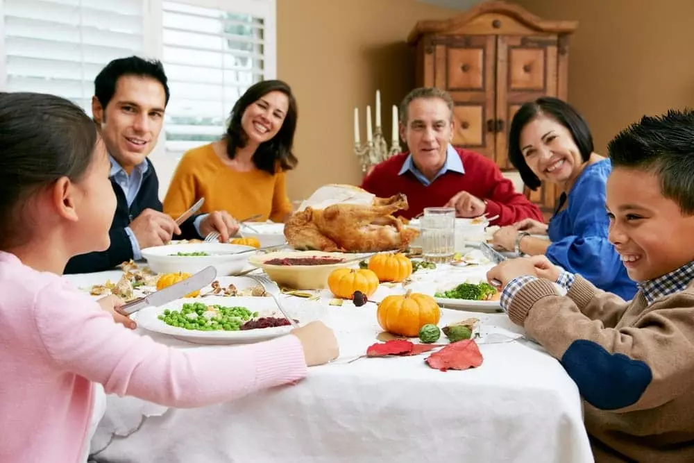 Smiling family celebrating Thanksgiving in Pigeon Forge TN.