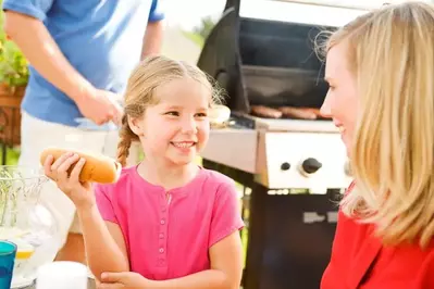 Little girl eating a hot dog at our Gatlinburg TN cabins for rent.