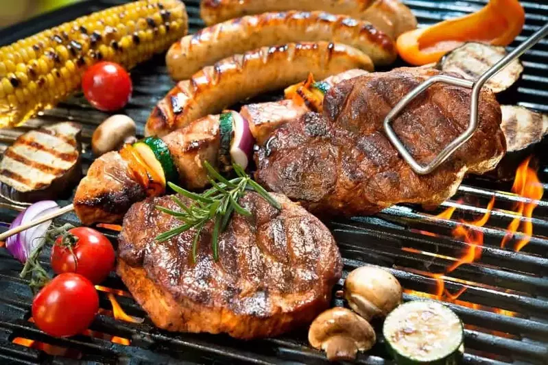 Various meats and vegetables on the grill at our Gatlinburg TN cabins for rent.