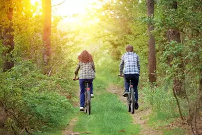 Happy couple going for a bike ride near our honeymoon cabins in Pigeon Forge.