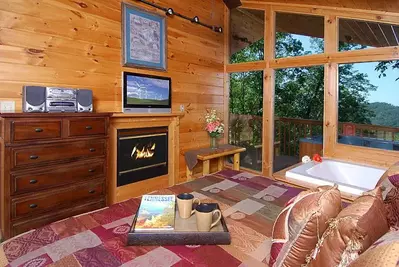 Afterglow romantic Gatlinburg cabin rentals bedroom with fireplace