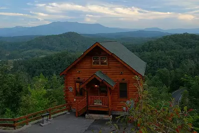 A great photo of one of our secluded cabins in Sevierville TN sorrounded by the Great Smoky Mountains.