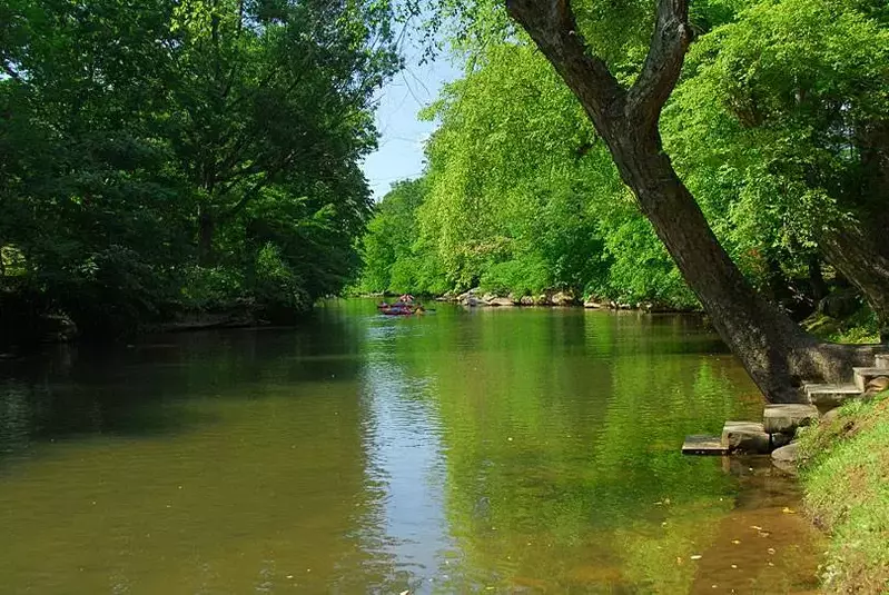 Someone tubing close to our Gatlinburg cabins on the river.