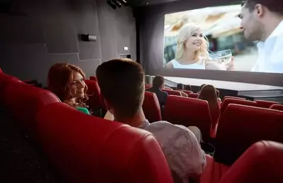 couple enjoying a movie in theater room
