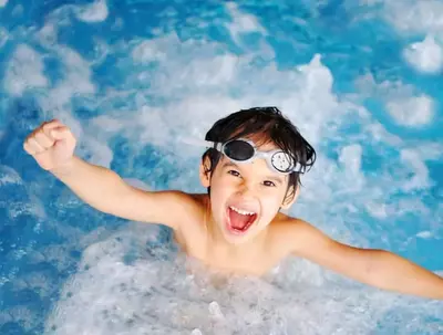 kid having fun in with cabin indoor pool