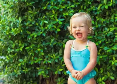 little girl smiling while staying at a Pigeon Forge cabin with pool access