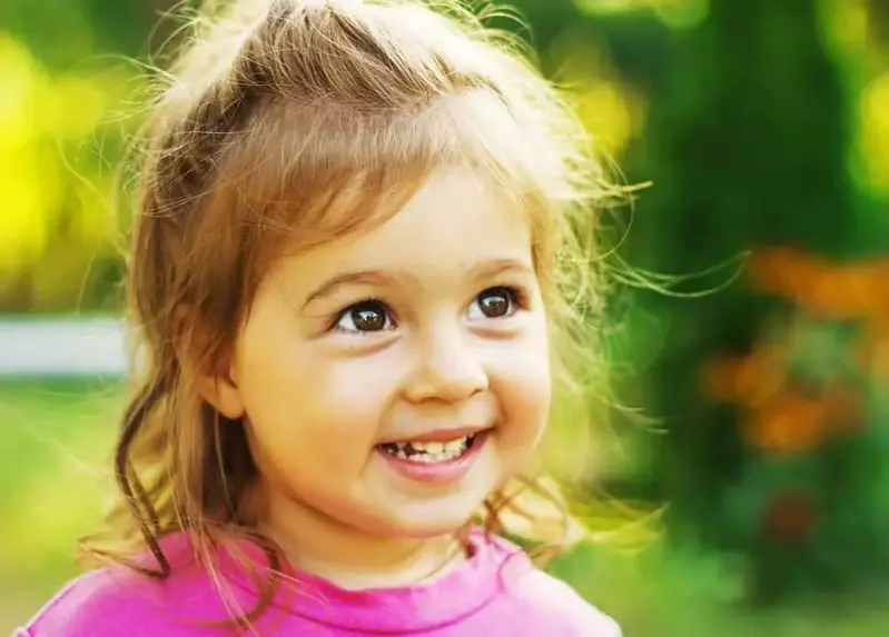 Little girl smiling on her Pigeon Forge cabin vacation.