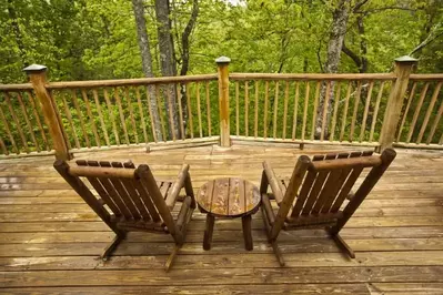 Two chairs sitting on the deck of a Pigeon Forge cabin rental