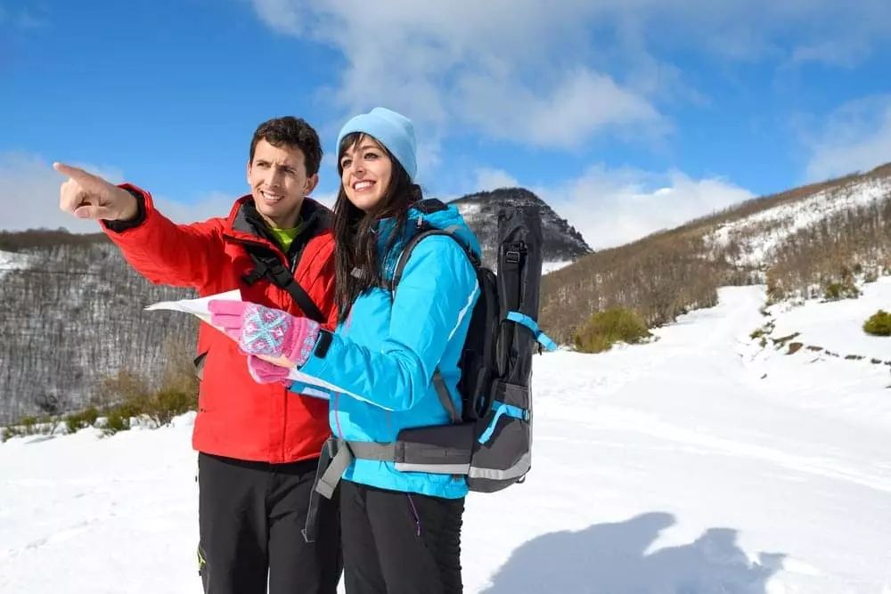 Couple using a map of the Smoky Mountains to point in the right direction