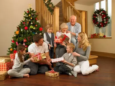 Family exchanging gifts for Christmas