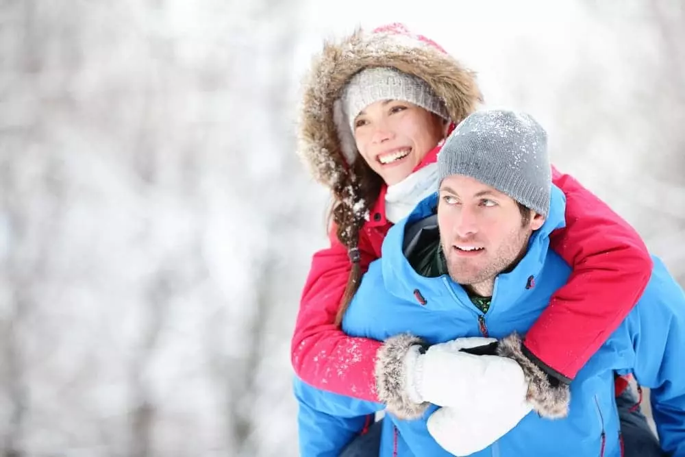 Man and woman on a romantic winter hike