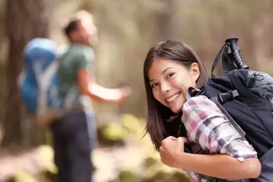 Couple hiking in the mountains on their honeymoon in Gatlinburg 