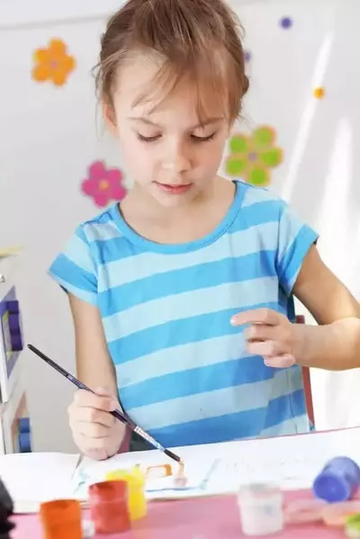 Little girl painting