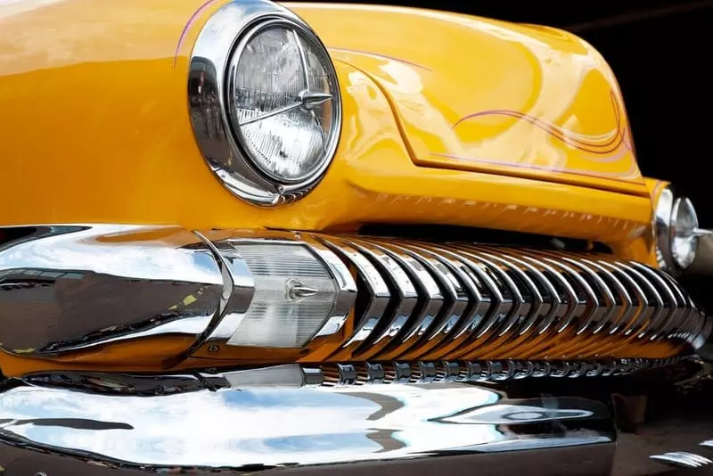 Bumper of classic yellow car