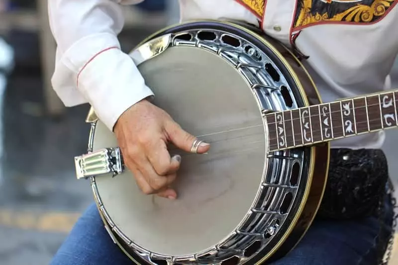 Closeup of man playing the banjo