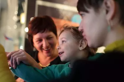 Portrait of happy family in a museum