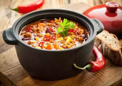 Chili con carne in black bowl