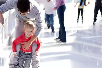 Father and son ice skating