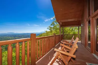 chairs on deck of cabin in Gatlinburg with mountain view