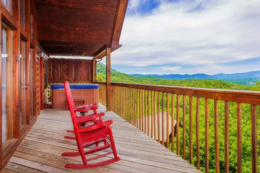 chairs on deck of a pigeon forge honeymoon cabin
