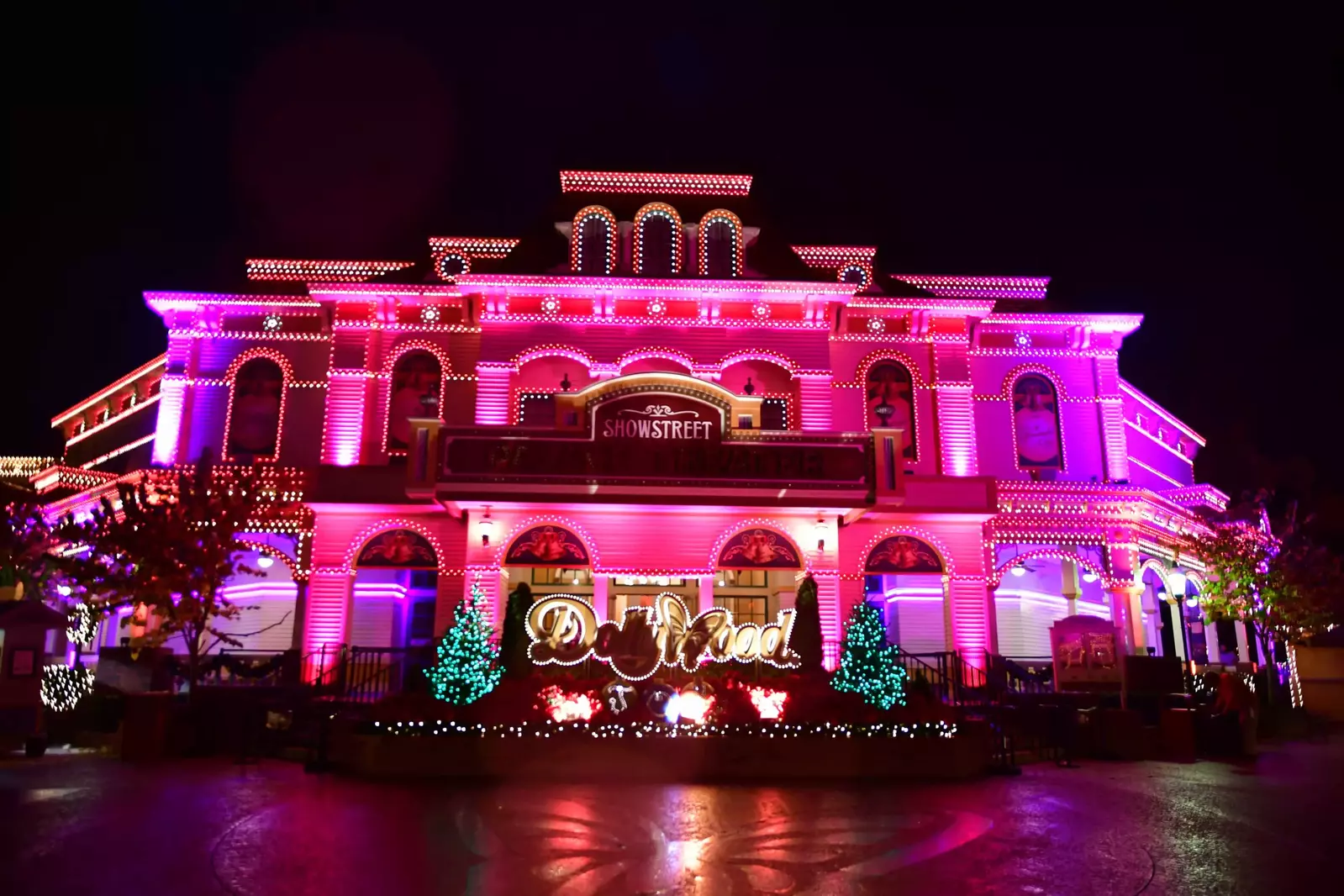 Showstreet Palace Theater and Dollywood sign lit up during Dollywood's Smoky Mountain Christmas