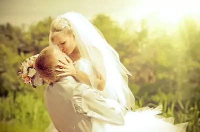 Bride and groom kissing