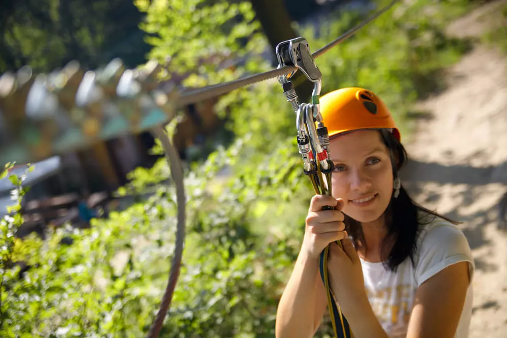 Woman preparing to zipline