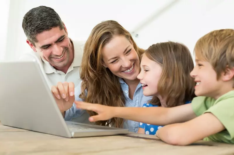 Family using laptop together