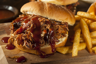 barbecue pulled pork sandwich with fries